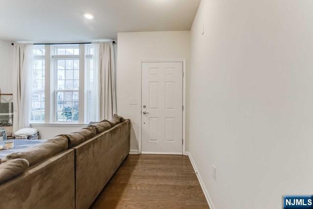 22 Veterans Drive Wood-Ridge, NJ 07075 - Photo 11 of 49 a living room with furniture and large windows
