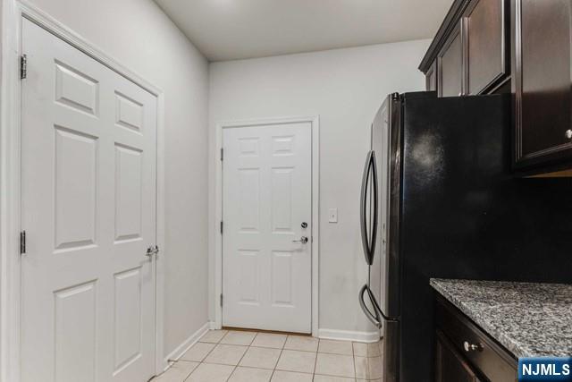 22 Veterans Drive Wood-Ridge, NJ 07075 - Photo 15 of 49 a kitchen with stainless steel appliances granite countertop a refrigerator and a sink