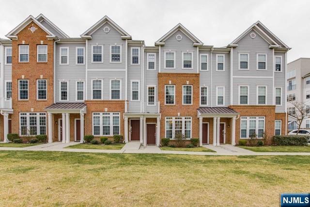 22 Veterans Drive Wood-Ridge, NJ 07075 - Photo 2 of 49 a front view of a house with a swimming pool