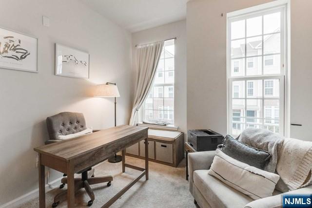 22 Veterans Drive Wood-Ridge, NJ 07075 - Photo 27 of 49 a living room with furniture and windows
