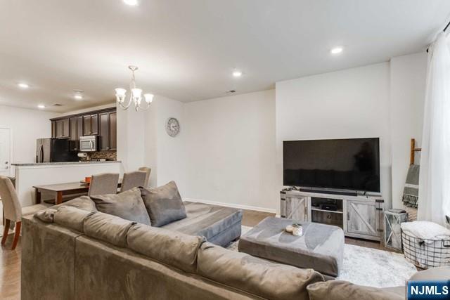 22 Veterans Drive Wood-Ridge, NJ 07075 - Photo 5 of 49 a living room with furniture and a flat screen tv