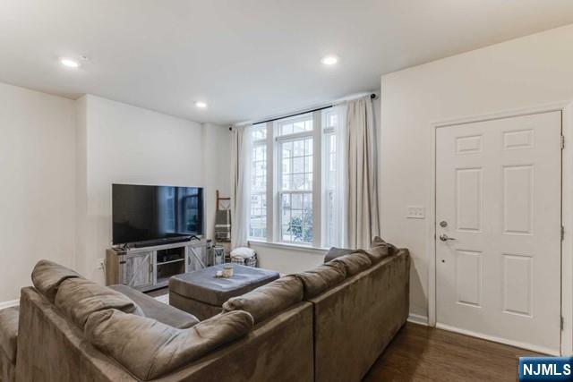 22 Veterans Drive Wood-Ridge, NJ 07075 - Photo 6 of 49 a living room with furniture and a flat screen tv