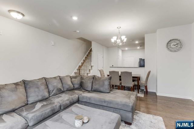 22 Veterans Drive Wood-Ridge, NJ 07075 - Photo 8 of 49 a living room with furniture and a chandelier
