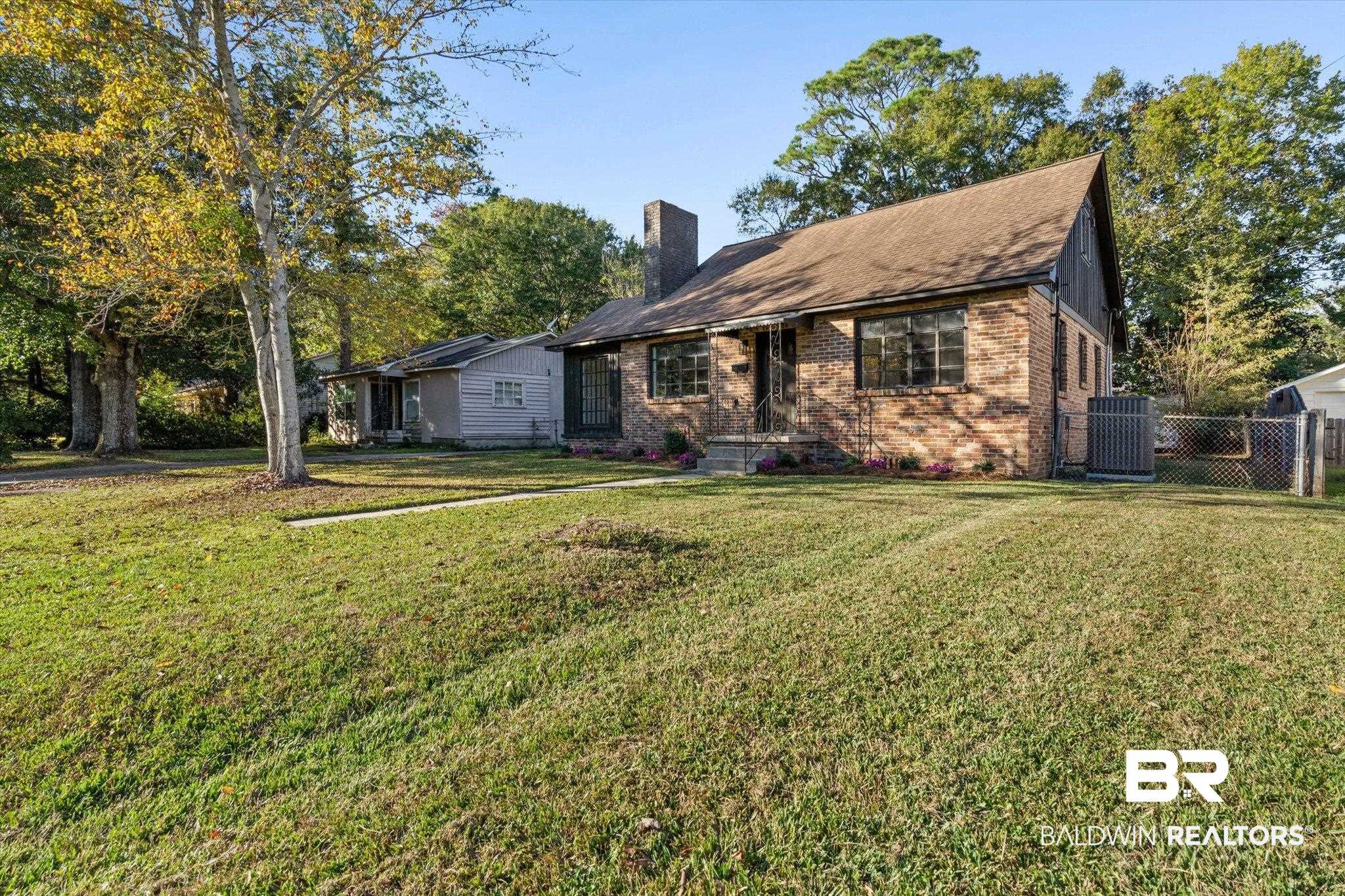 2806 Exter Drive Mobile, AL 36606 - Photo 20 of 24 View of front of property with brick siding and a chimney