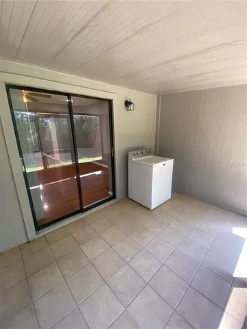 a room with a bed and a mirror