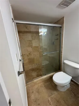 a outdoor space with lots of chairs and mirrors