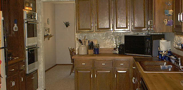 8530 North Creek Road Roscoe, IL 61073 - Photo 3 of 6 a kitchen with stainless steel appliances a sink stove and refrigerator