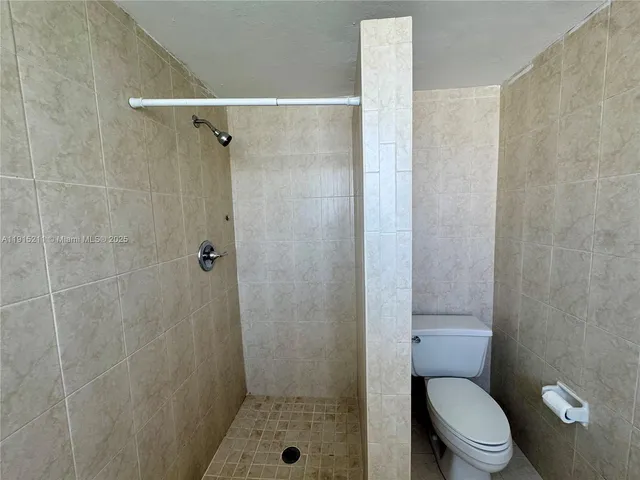 a big room with closet and windows