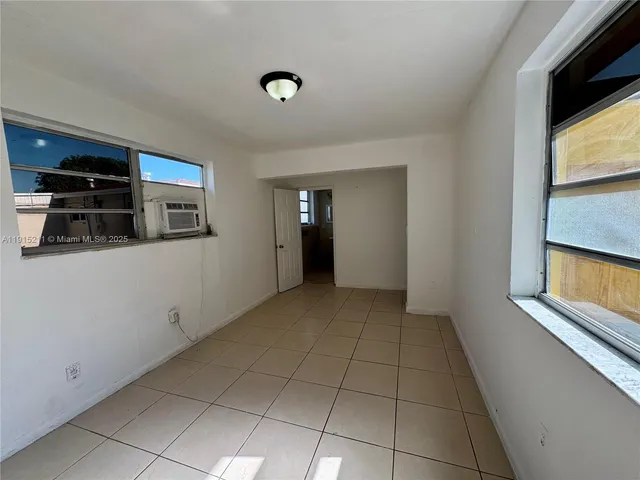 a bathroom with a toilet sink and shower