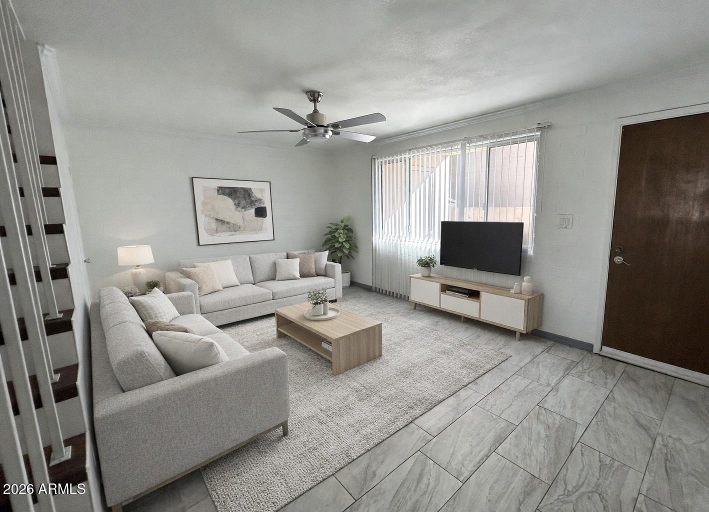 a living room with furniture and a flat screen tv