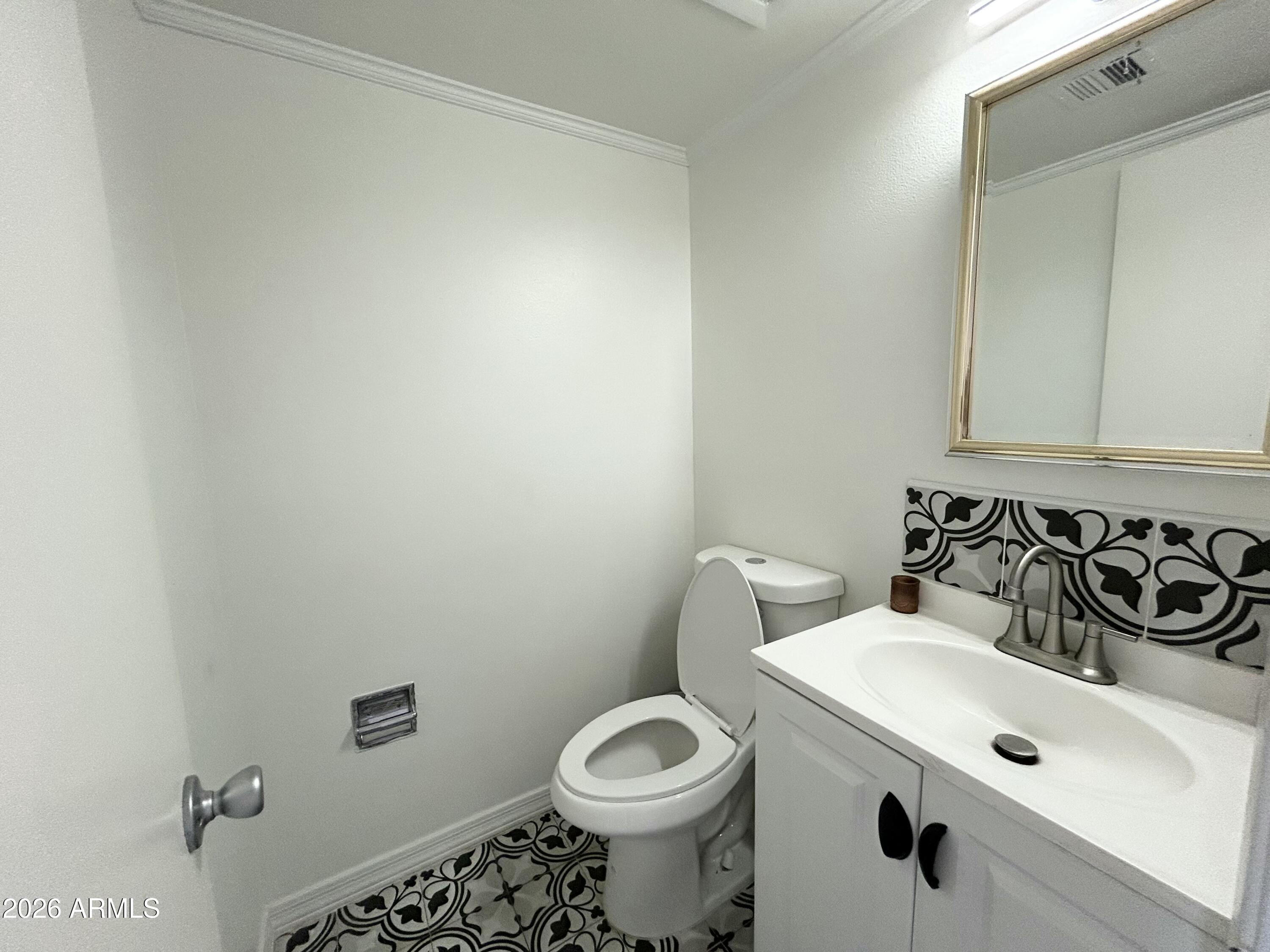 6565 North 19th Avenue, Unit 27 Phoenix, AZ 85015 - Photo 14 of 17 a bathroom with a sink and a toilet