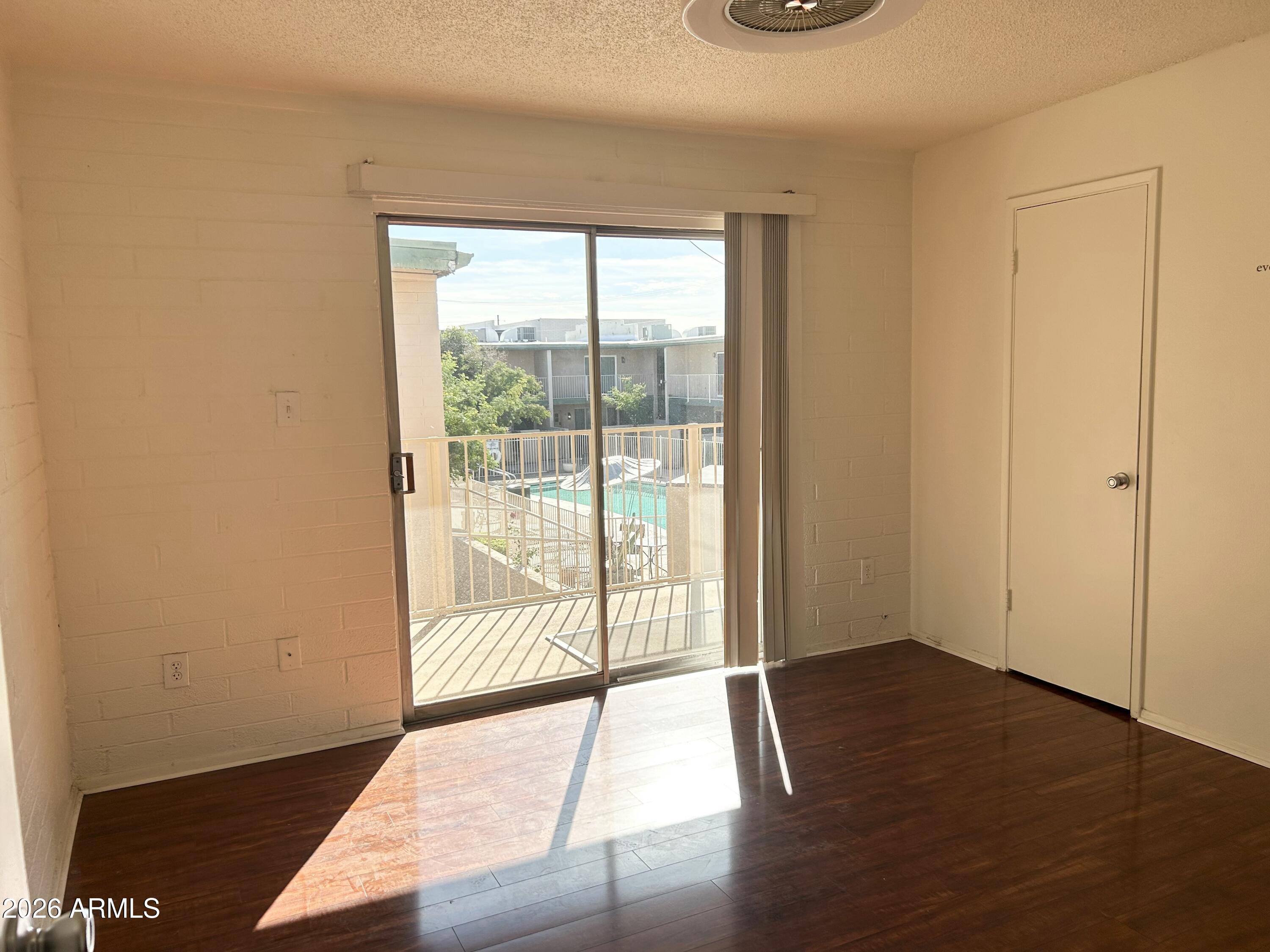 6565 North 19th Avenue, Unit 27 Phoenix, AZ 85015 - Photo 7 of 17 a view of an empty room and window