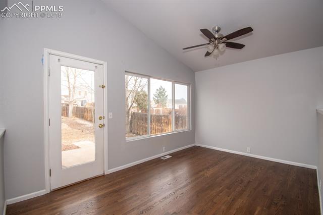 6734 Akron Road Colorado Springs, CO 80923 - Photo 11 of 31 A big picture window looks out to the backyard