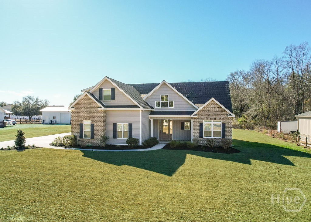 1355 Old Louisville Road Guyton, GA 31312 - Photo 3 of 43 Welcome Home!
*Grass Enhanced for Photos*