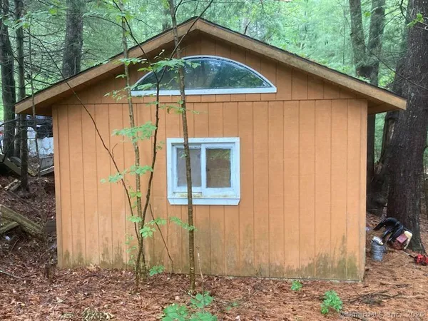 a blue and white house with a outdoor space