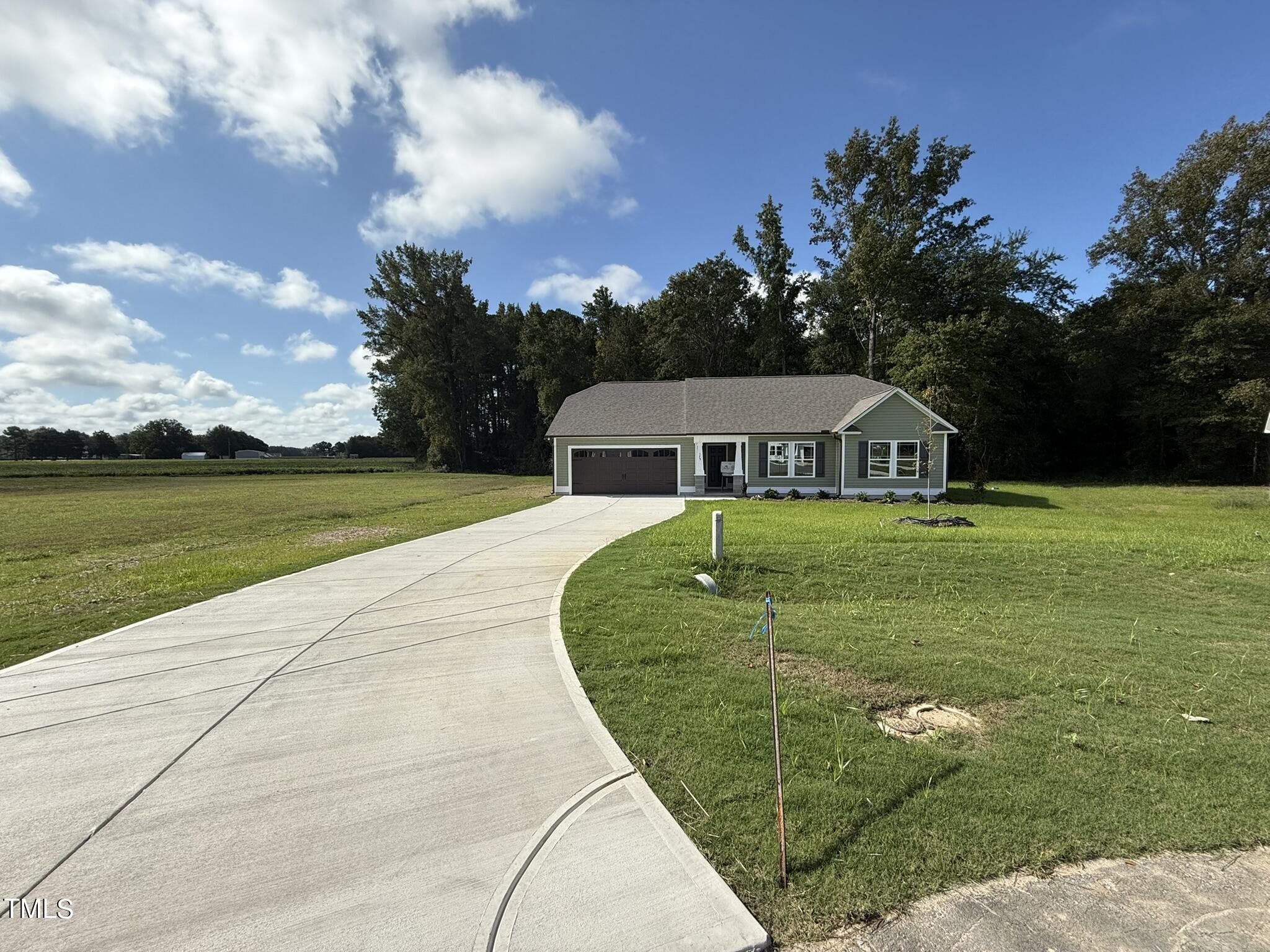 175 Grace Ridge Benson, NC 27504 - Photo 1 of 19 a view of a house with swimming pool and a yard