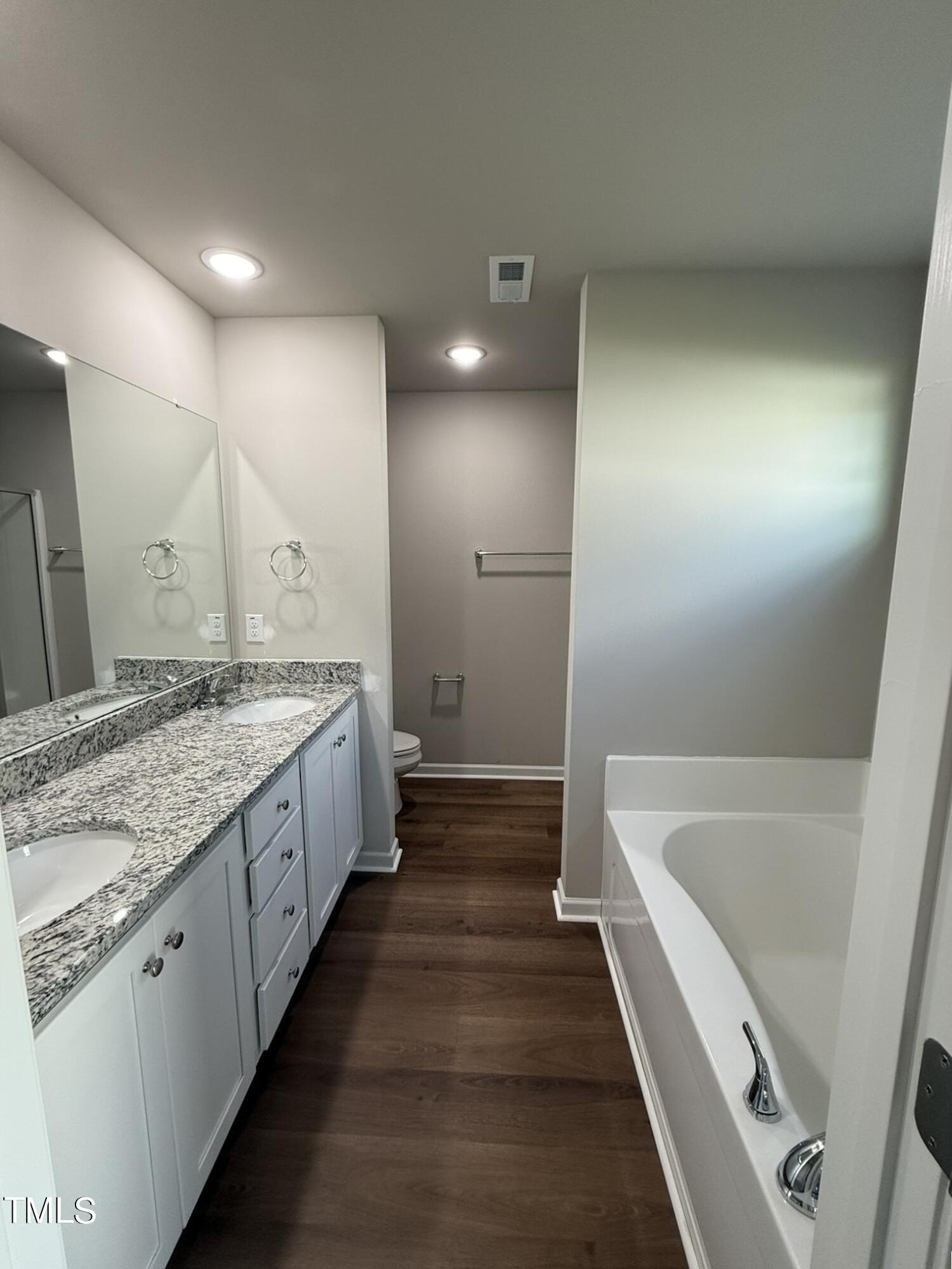175 Grace Ridge Benson, NC 27504 - Photo 12 of 19 a bathroom with a tub sink and vanity