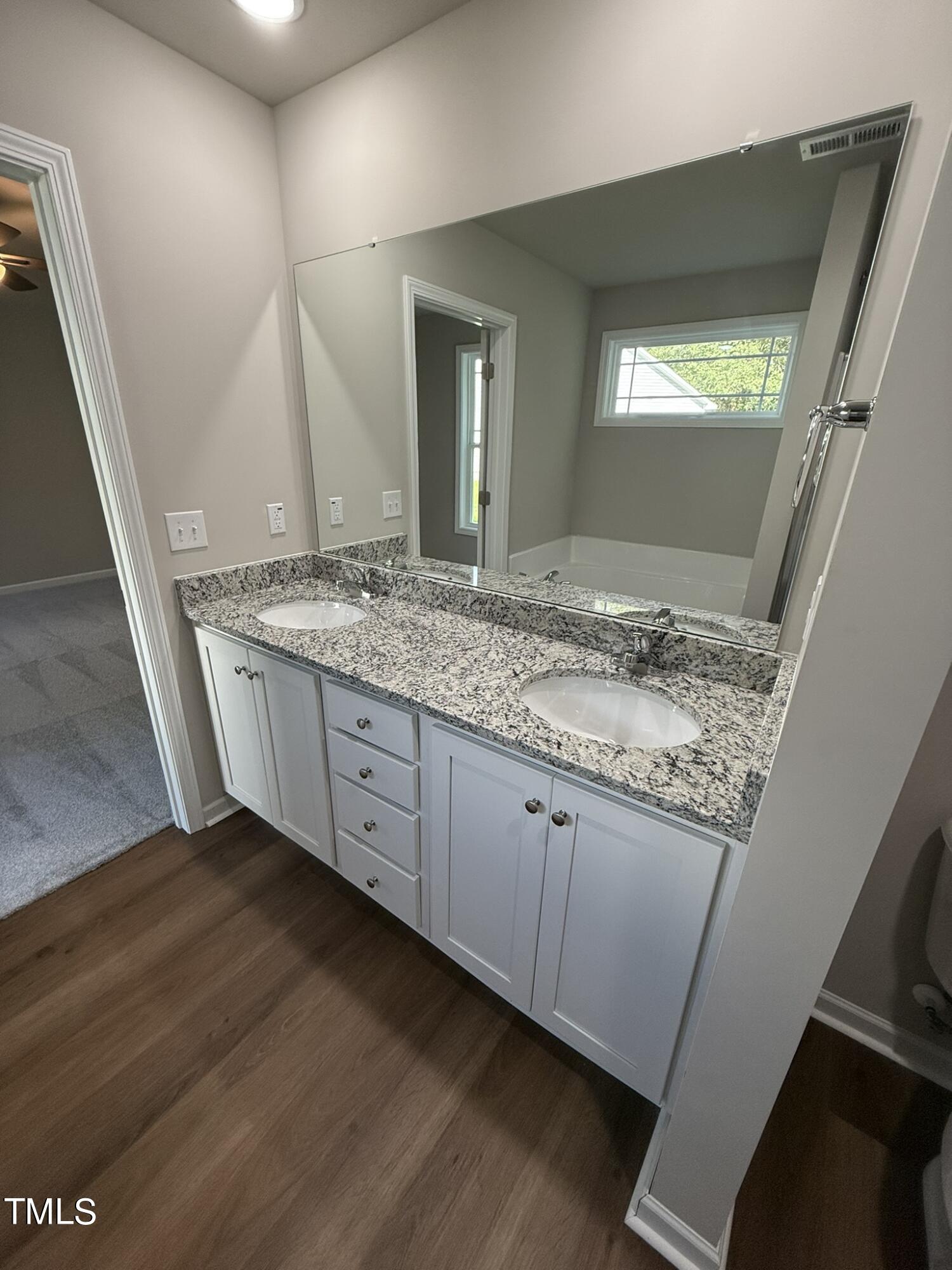 175 Grace Ridge Benson, NC 27504 - Photo 13 of 19 a view of bathroom with sink and mirror