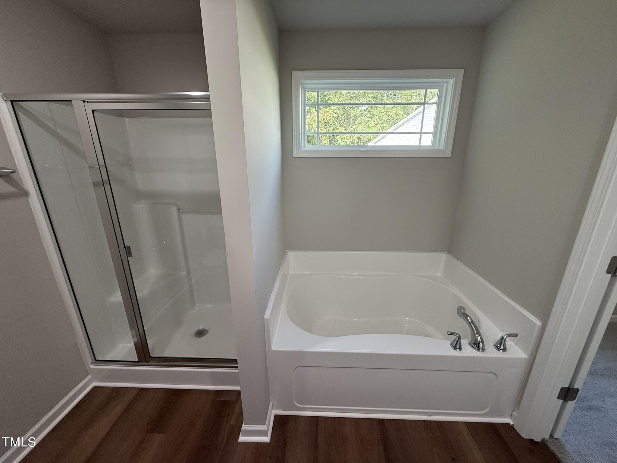 175 Grace Ridge Benson, NC 27504 - Photo 14 of 19 a white bath tub sitting next to a window