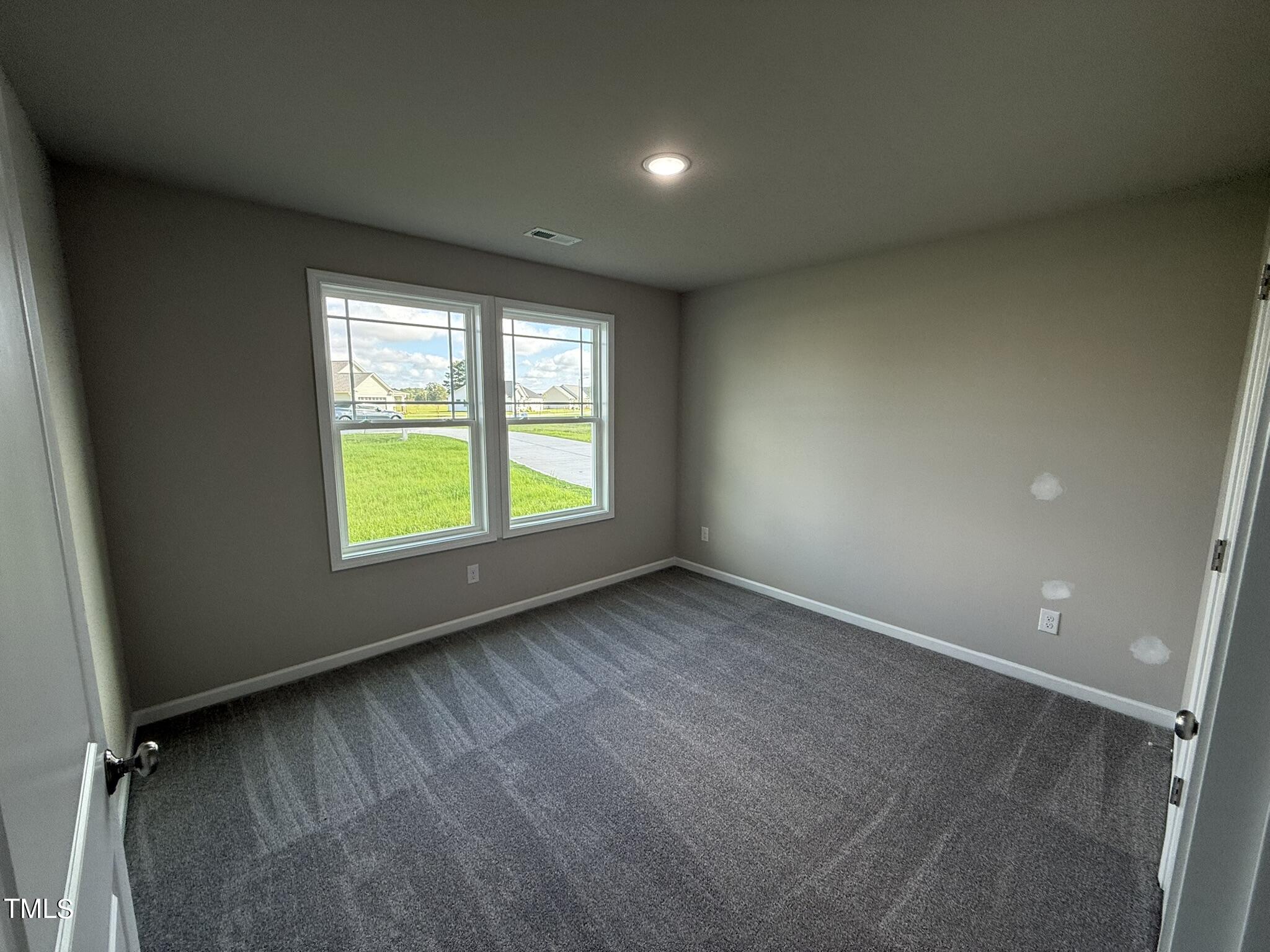 175 Grace Ridge Benson, NC 27504 - Photo 15 of 19 an empty room with a window