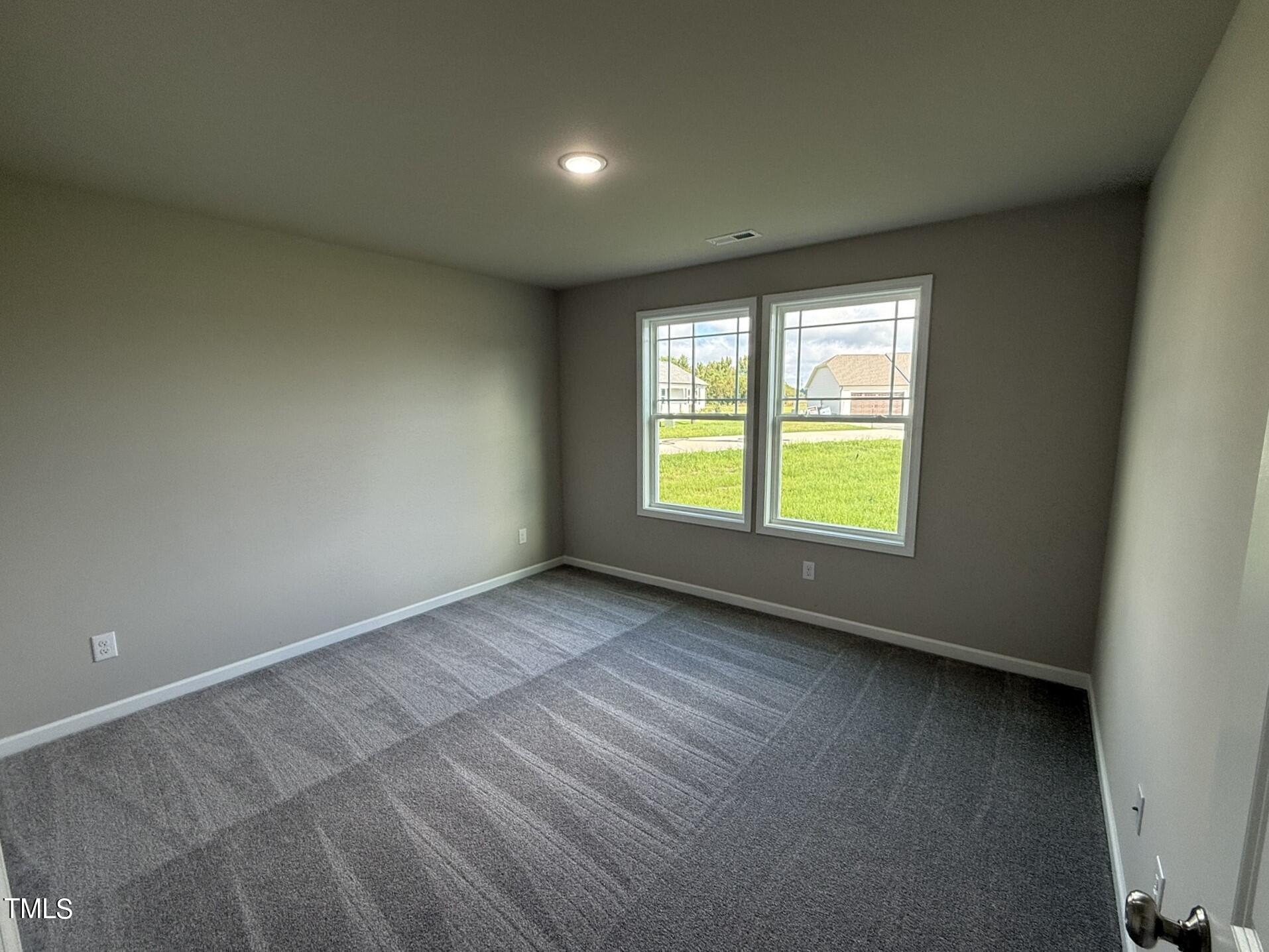 175 Grace Ridge Benson, NC 27504 - Photo 16 of 19 an empty room with a window