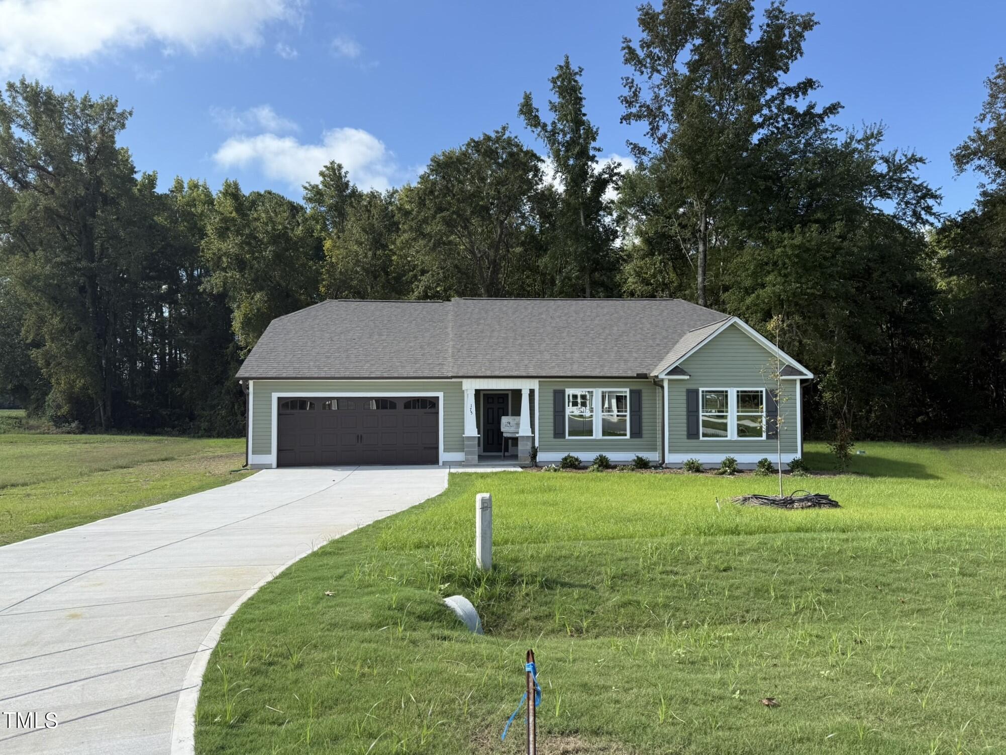 175 Grace Ridge Benson, NC 27504 - Photo 2 of 19 a front view of a house with a yard