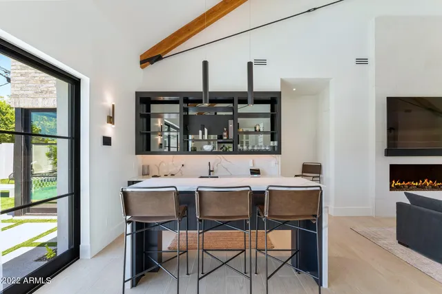 a bathroom with a double vanity sink a mirror and a bathtub