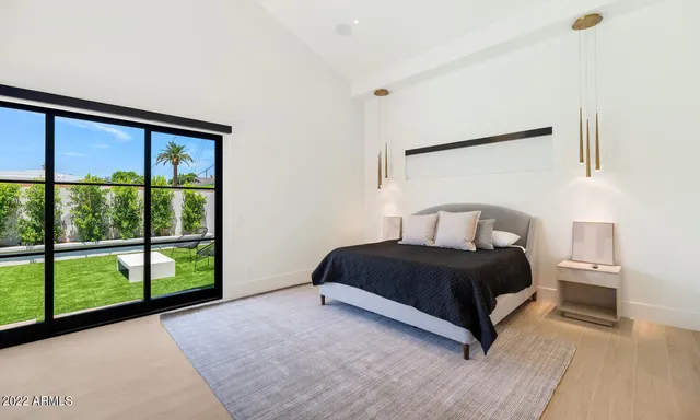 a room with a bed and a window