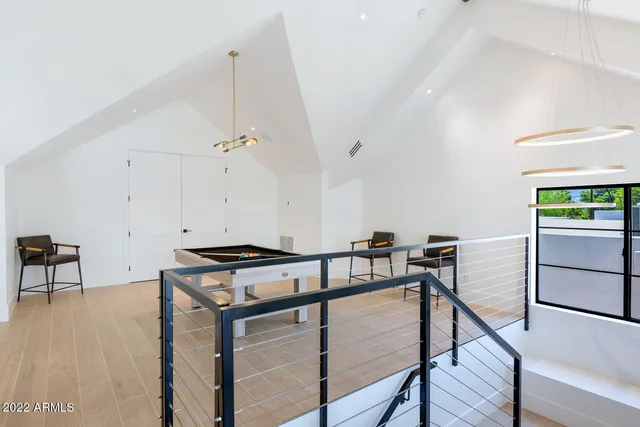 a patio with a table and chairs