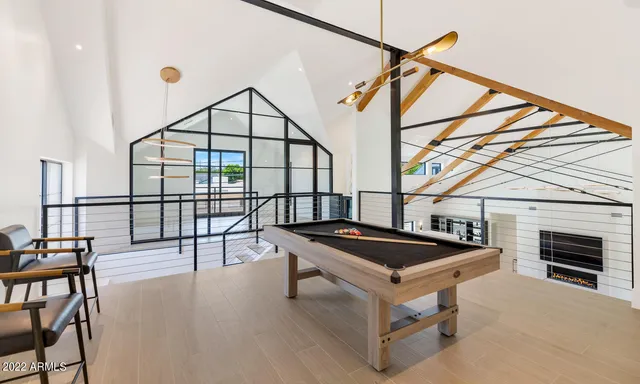 a swimming pool with outdoor seating and yard