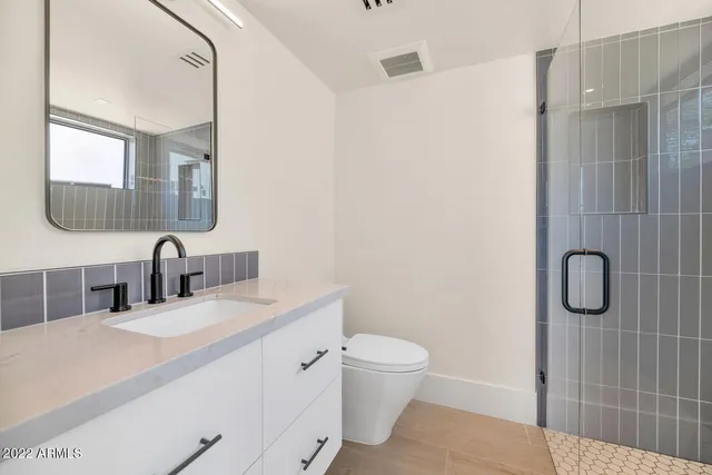 a view of a patio with dining table and chairs with wooden floor