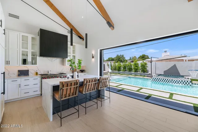 a room with a large window and a couch