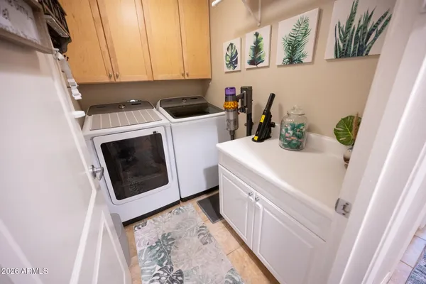 a utility room with dryer and washer