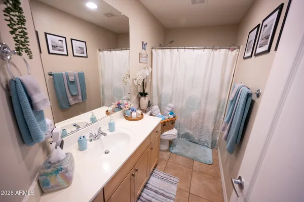a bathroom with a sink a mirror and a shower
