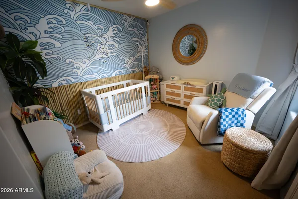 a view of a livingroom with furniture and windows