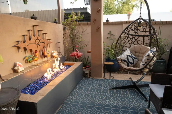 a living room with furniture and a rug