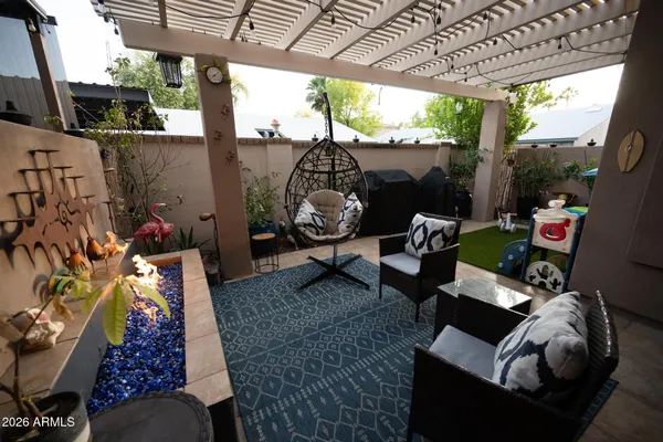 a view of porch with furniture and a backyard