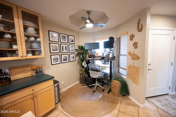 a workspace with furniture and wooden floor
