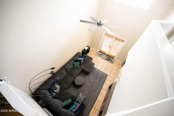 a view of living room with furniture and wooden floor