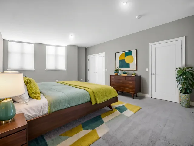 a bedroom with a bed and dresser