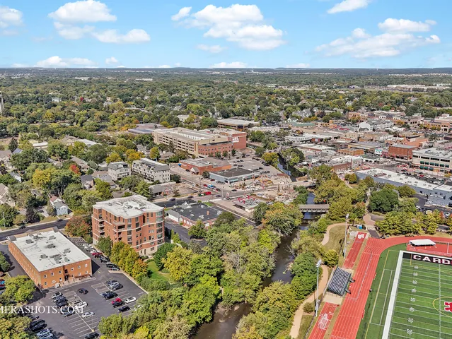 an aerial view of residential houses with outdoor space
