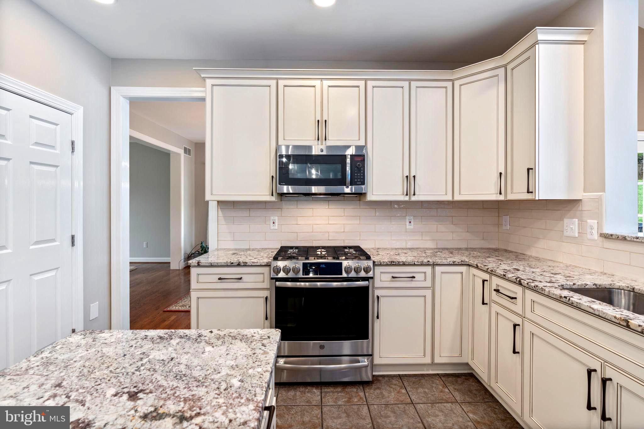 1231 Corbett Road Monkton, MD 21111 - Photo 13 of 84 Kitchen with custom painted wood cabinetry