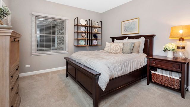 a bed room with a bed and a night stand