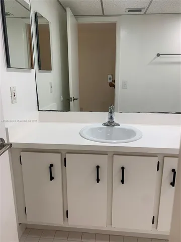 a sink with a mirror