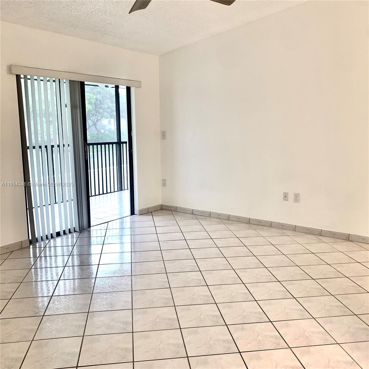 469 Northeast 207th Lane, Unit 207 Miami, FL 33179 - Photo 19 of 25 a view of an empty room and window
