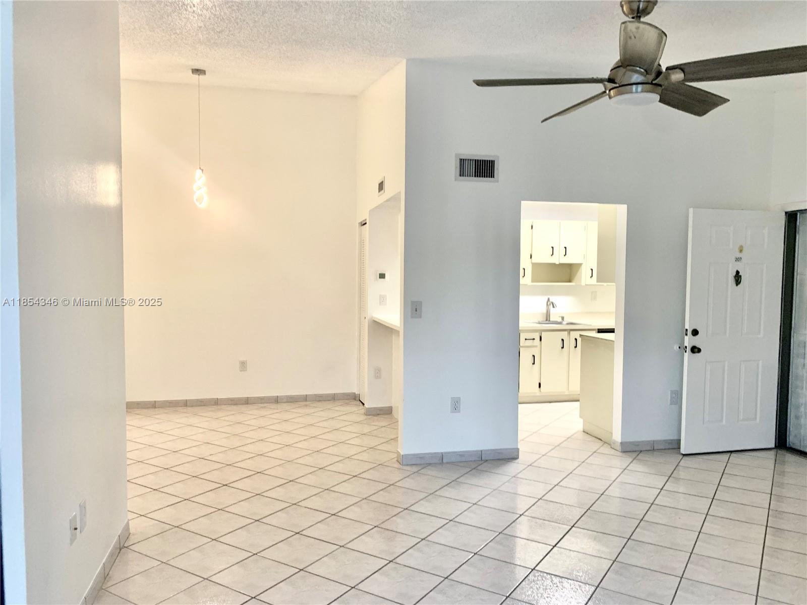 469 Northeast 207th Lane, Unit 207 Miami, FL 33179 - Photo 2 of 25 a view of an empty room