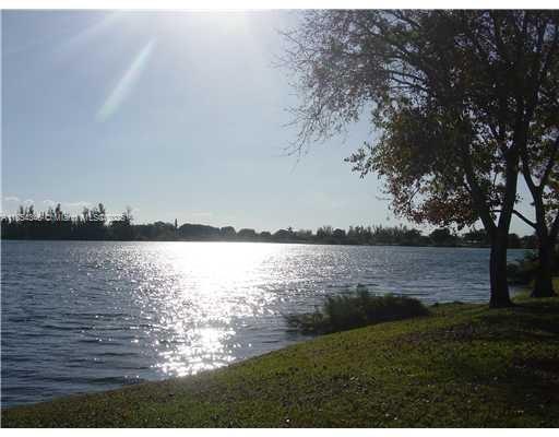 469 Northeast 207th Lane, Unit 207 Miami, FL 33179 - Photo 25 of 25 a view of a lake from a yard