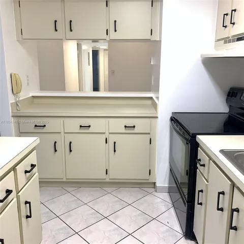 a kitchen with a stove and a sink