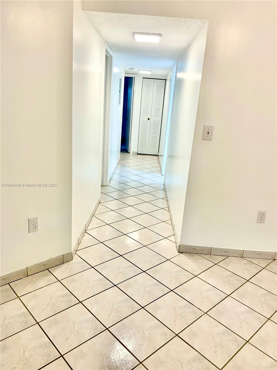 469 Northeast 207th Lane, Unit 207 Miami, FL 33179 - Photo 7 of 25 a view of a room with wooden floor