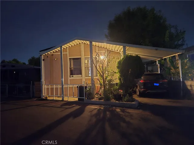 a view of building with car parked